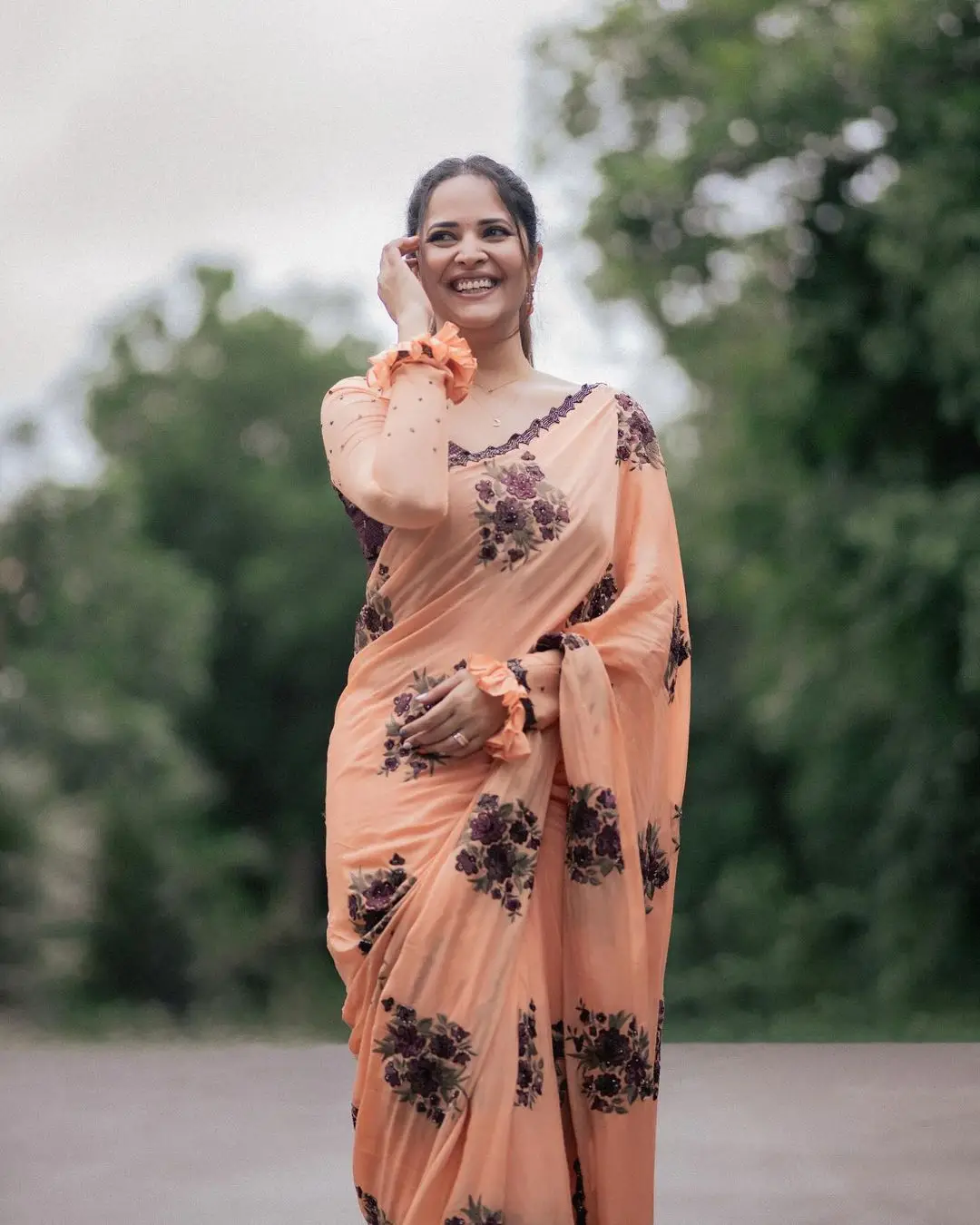 Anasuya Bharadwaj Wearing Beautiful Earrings Orange Saree Blouse